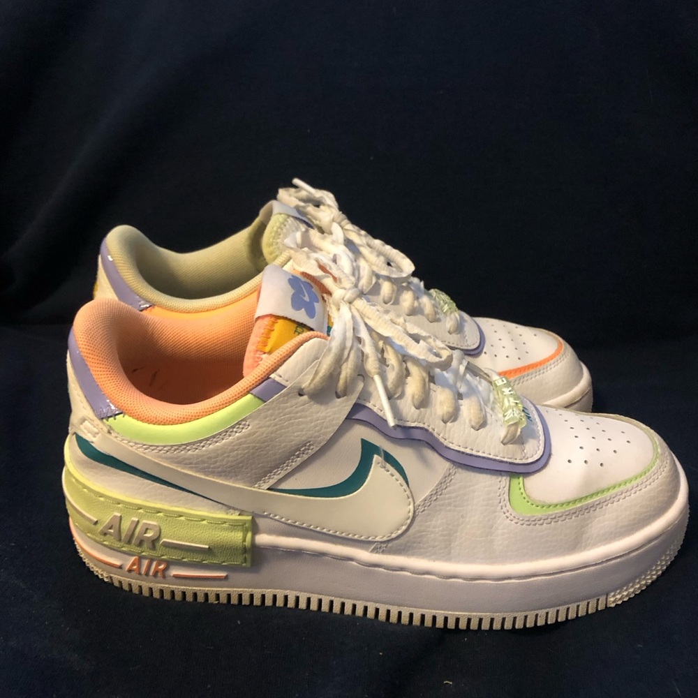 Size 8 in women’s. Nike Air Force 1s with a thick platform.